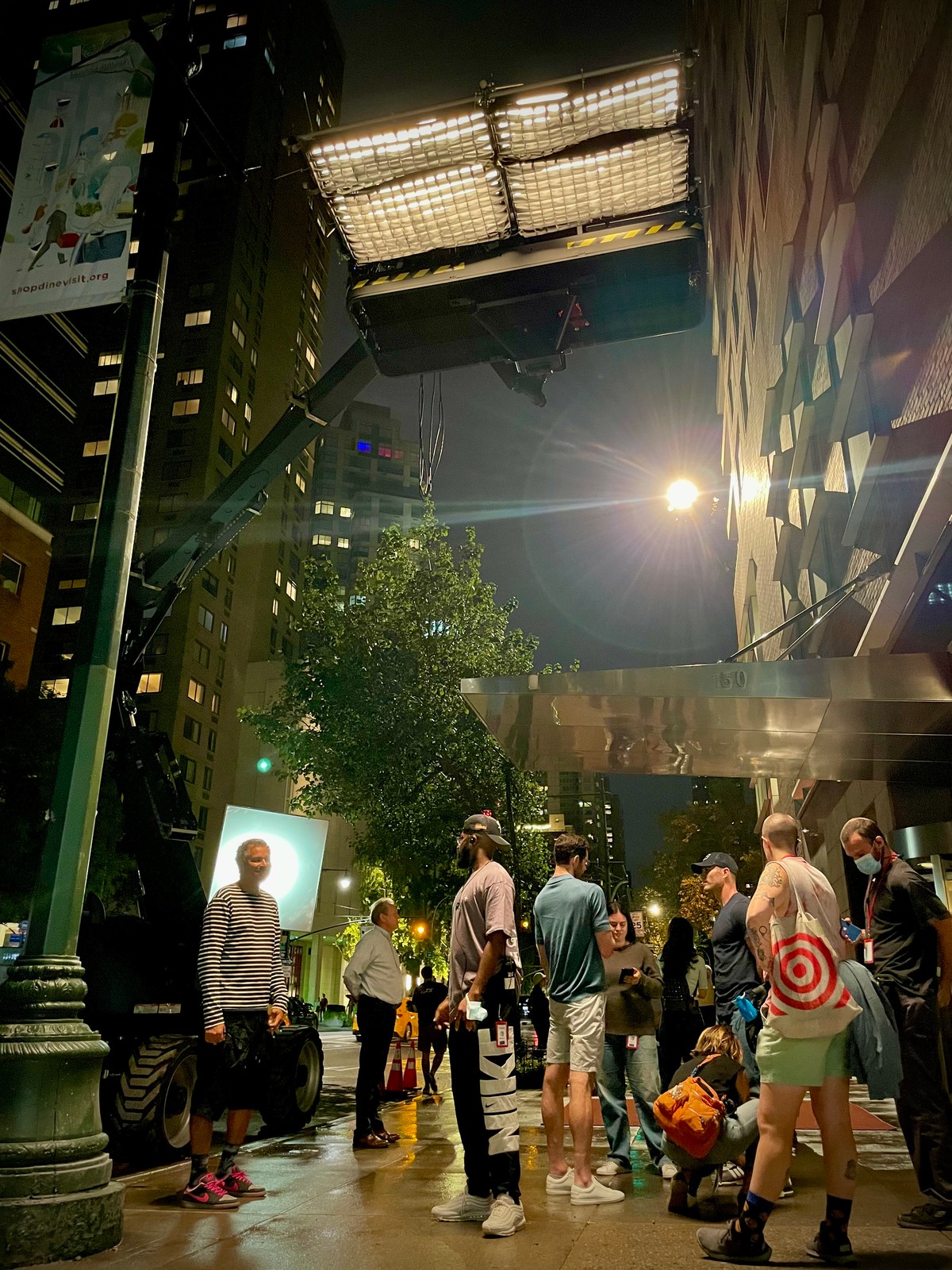 Exterior night beat — practical lighting rig staged for a quiet street scene