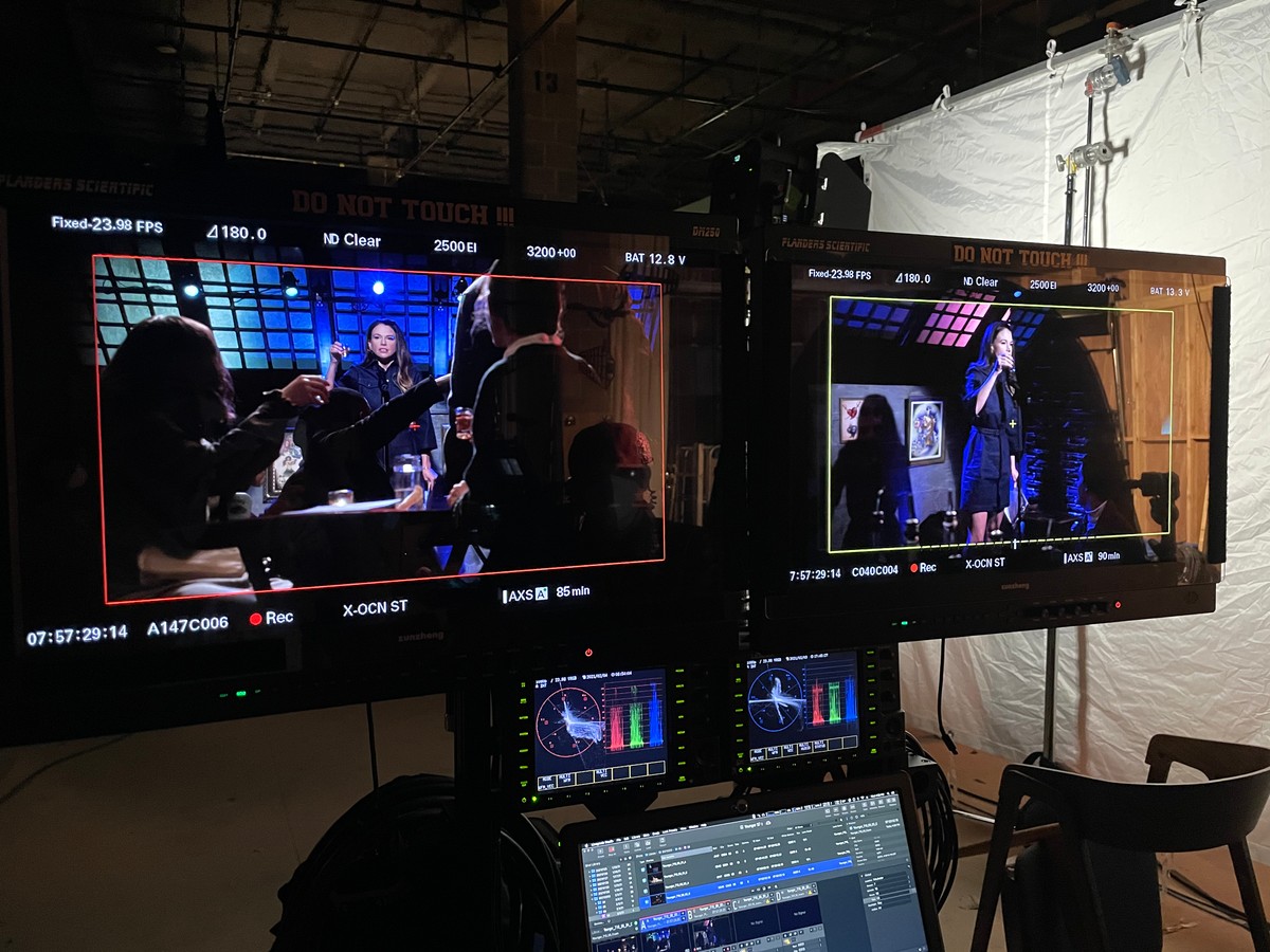 DIT cart at the open-mic scene — two Flanders Scientific monitors showing the take from two angles, color analysis below