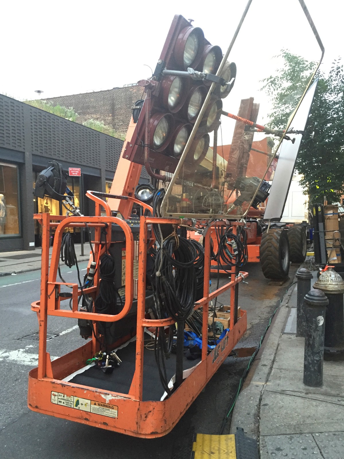 Tungsten PAR bank on a JLG condor lift, parked on a New York City street ready to rig