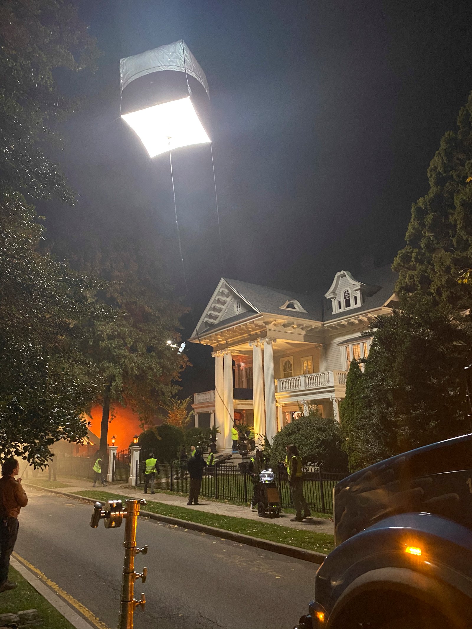Balloon moonbox floating above mansion exterior — Monsterland